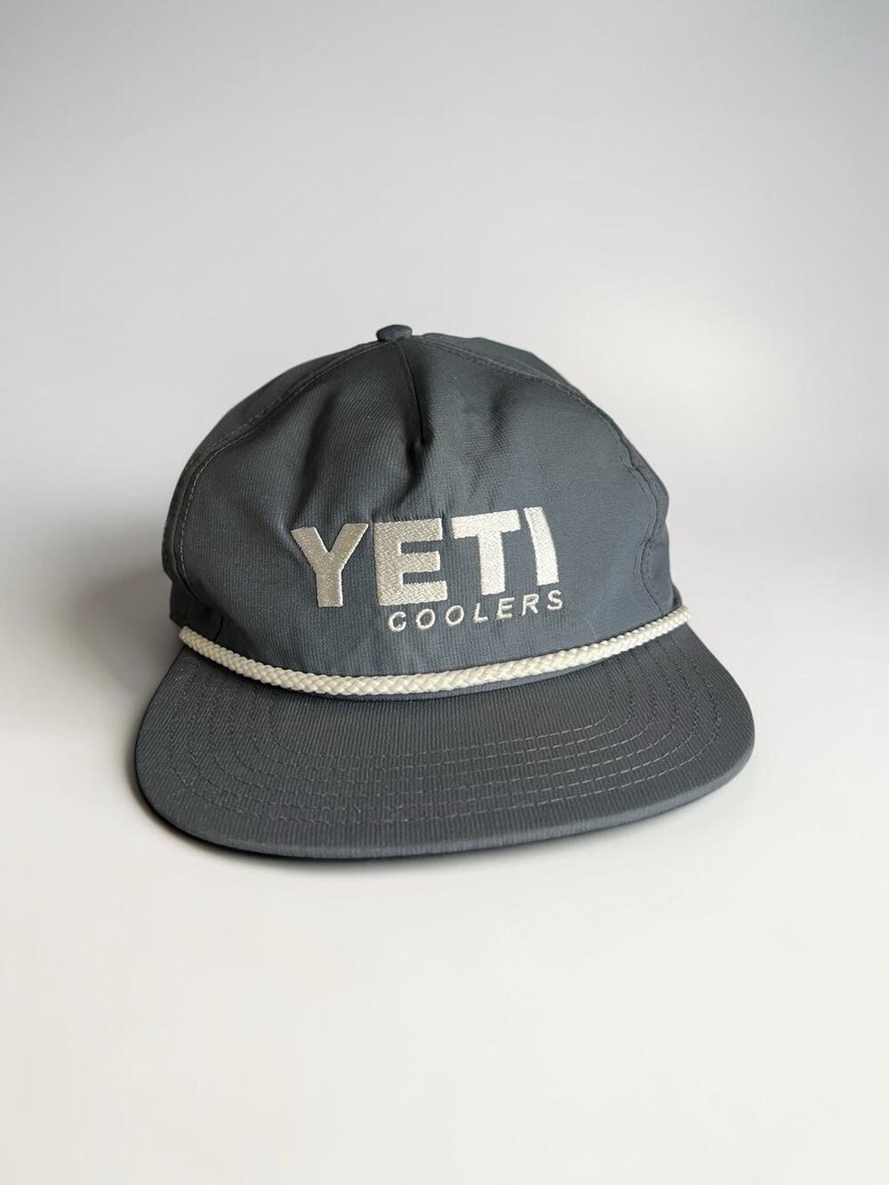YETI Coolers hat features a distinct white decorative rope across brim Grey